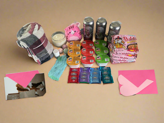 Assorted items including snacks, drinks, and stationery on a table.